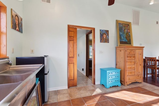 kitchen with light tile patterned floors and ceiling fan