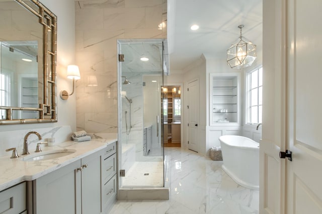 bathroom featuring vanity, a wealth of natural light, and plus walk in shower