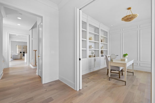 office area featuring crown molding and light wood-type flooring