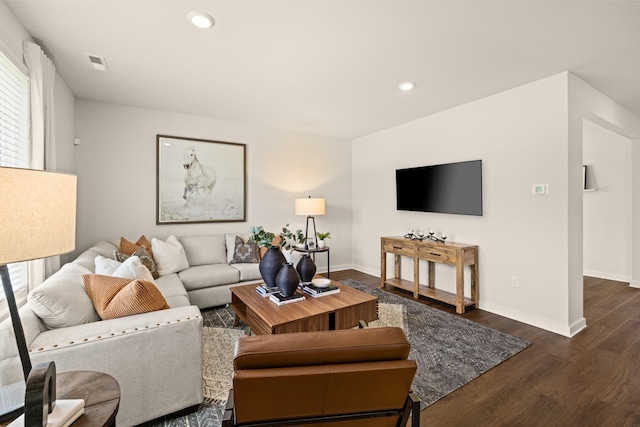 living room featuring dark hardwood / wood-style floors