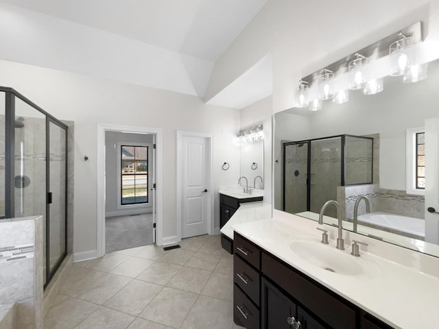 bathroom featuring tile patterned flooring, plenty of natural light, lofted ceiling, and shower with separate bathtub