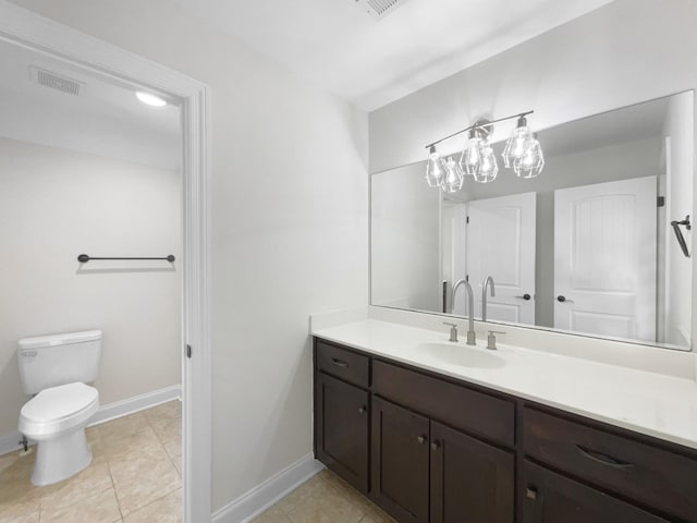 bathroom with tile patterned floors, vanity, and toilet