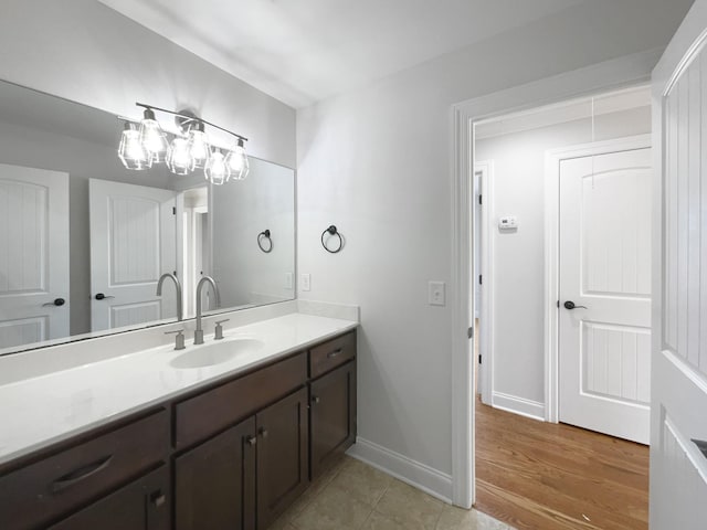 bathroom featuring hardwood / wood-style flooring and vanity