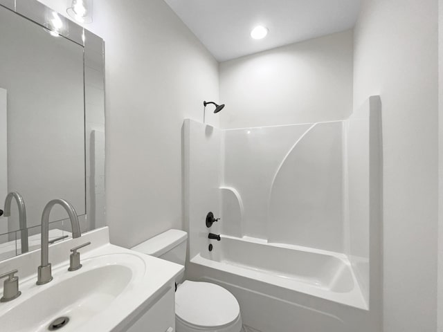 full bathroom featuring toilet, vanity, and shower / bathing tub combination