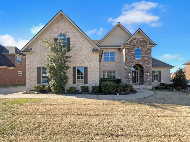 view of front of home with a front lawn