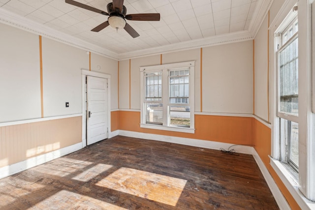 empty room featuring ornamental molding, dark hardwood / wood-style floors, and ceiling fan