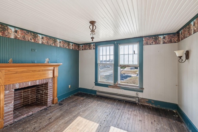 unfurnished living room featuring a baseboard radiator, dark hardwood / wood-style floors, and a fireplace