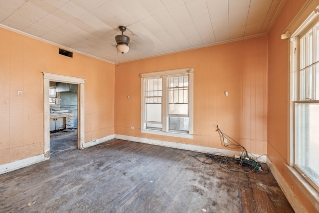 spare room featuring dark hardwood / wood-style flooring, ornamental molding, and ceiling fan