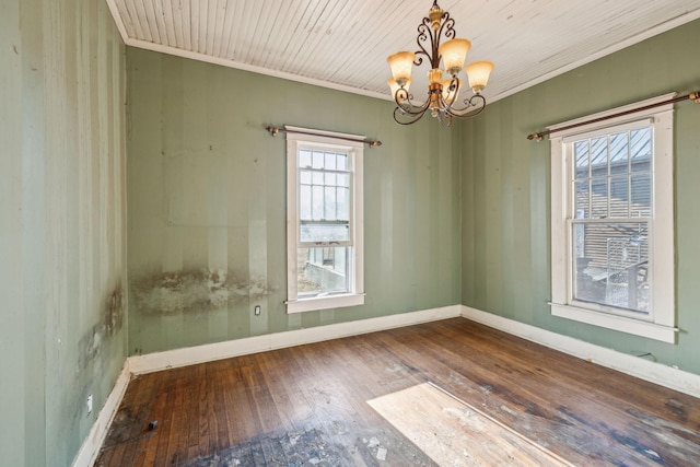 unfurnished room featuring hardwood / wood-style flooring, ornamental molding, wood ceiling, and a chandelier