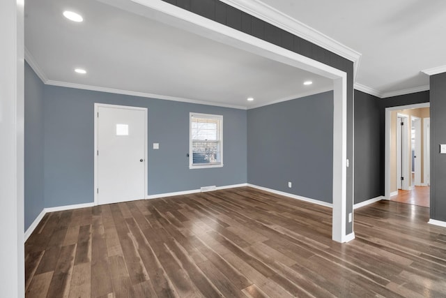 foyer with crown molding and dark hardwood / wood-style floors