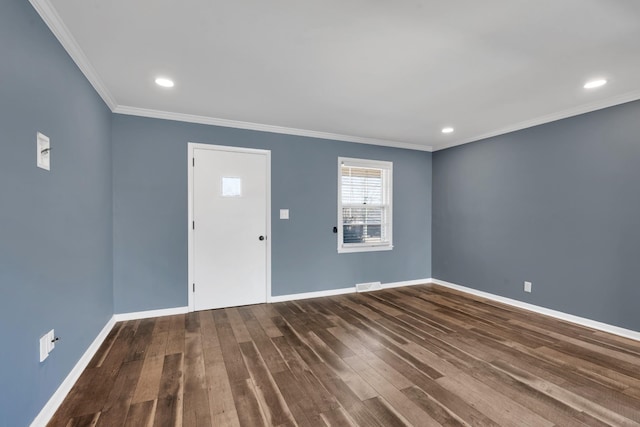 foyer entrance featuring ornamental molding and dark hardwood / wood-style floors