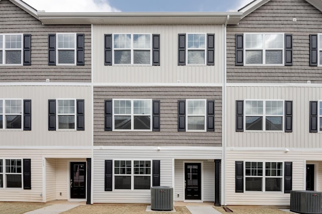 townhome / multi-family property featuring central AC unit