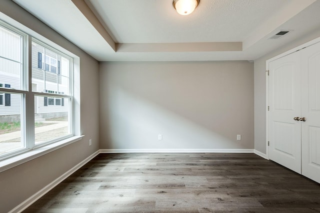 spare room featuring dark hardwood / wood-style flooring