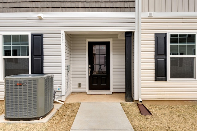 property entrance featuring central AC unit