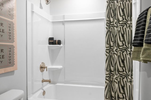 bathroom with toilet and shower / bath combo with shower curtain