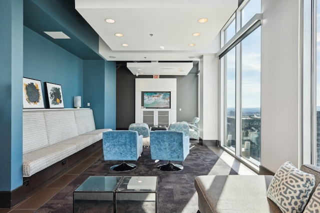 living room featuring a wall of windows