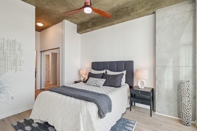 bedroom with ceiling fan and light wood-type flooring