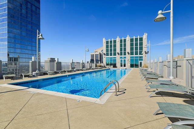 view of swimming pool featuring a patio