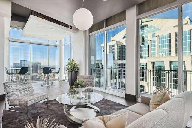 living room with expansive windows and a healthy amount of sunlight