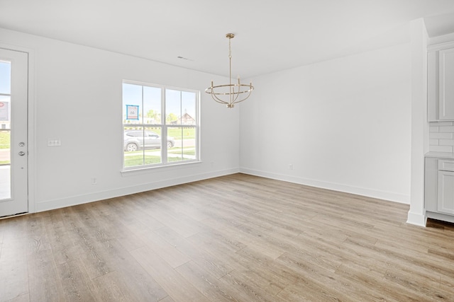 5061 Greentree Dr, Smyrna, TN 37167 - unfurnished dining area featuring a chandelier, healthy amount of natural light, and light wood-style flooring
