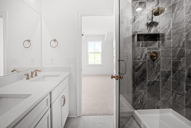 5061 Greentree Dr, Smyrna, TN 37167 - full bathroom with double vanity, a stall shower, and baseboards