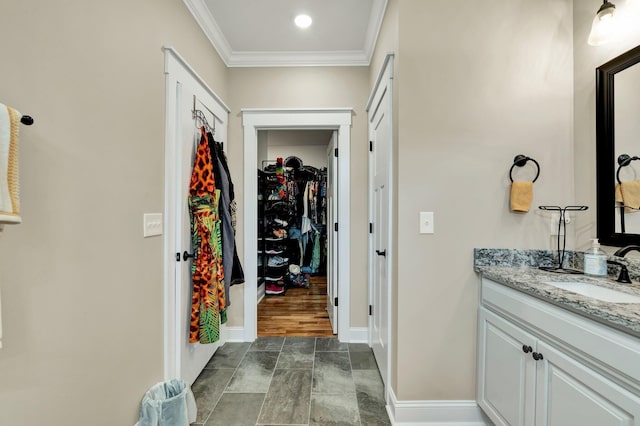 bathroom featuring vanity and crown molding