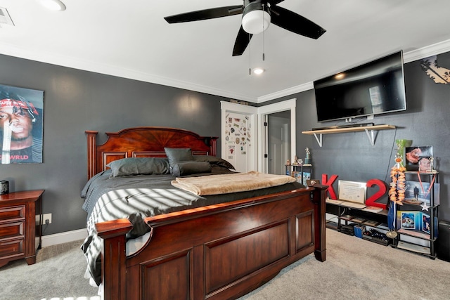 bedroom with crown molding, light colored carpet, and ceiling fan