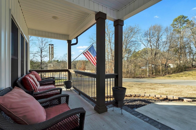 wooden terrace featuring covered porch