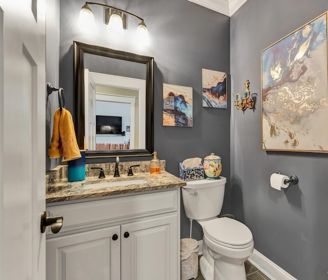 bathroom featuring vanity and toilet