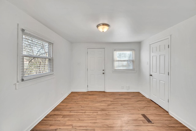 unfurnished room featuring light hardwood / wood-style flooring