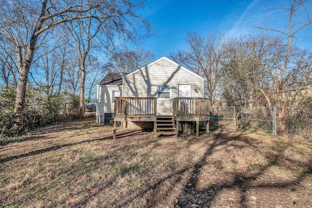 back of property featuring a wooden deck and central AC