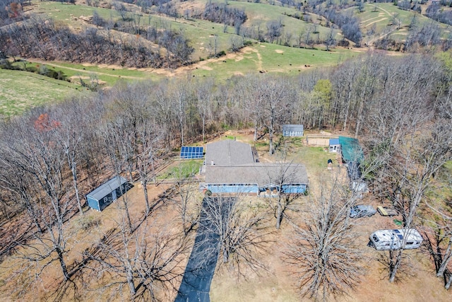 birds eye view of property with a rural view