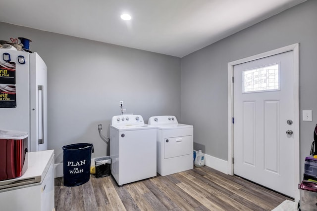 laundry area featuring hardwood / wood-style flooring and independent washer and dryer