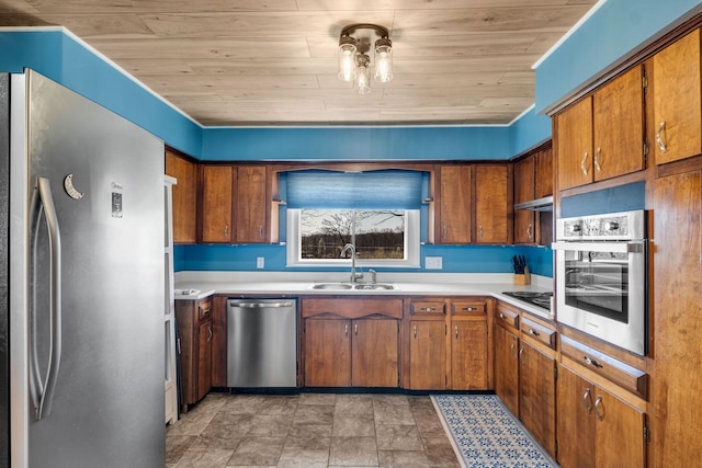 kitchen with appliances with stainless steel finishes, sink, and wood ceiling