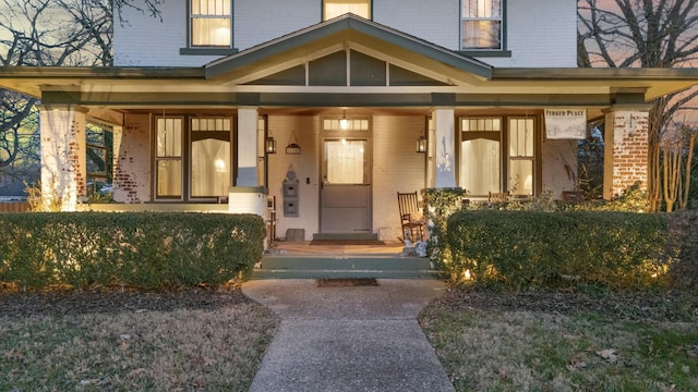 property entrance with covered porch