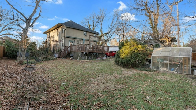 view of yard with an outbuilding and a deck