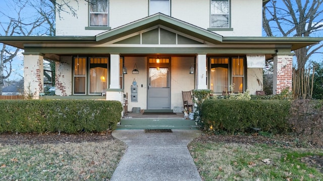 doorway to property with a porch