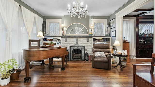 sitting room featuring an inviting chandelier and wood-type flooring