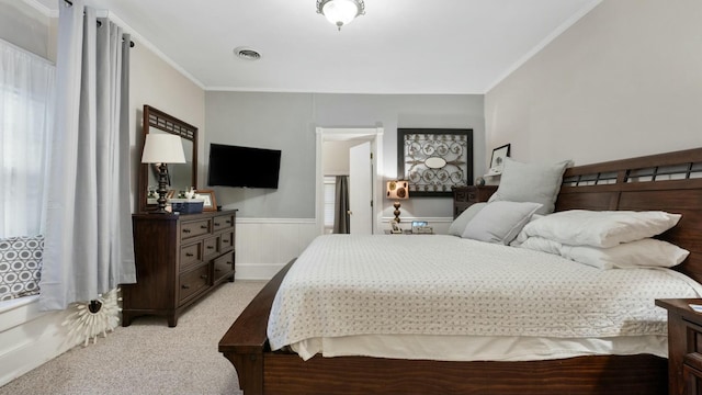 carpeted bedroom with crown molding