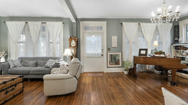 living room with dark wood-type flooring, beam ceiling, and an inviting chandelier