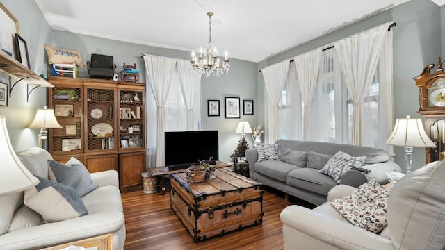 living room with dark hardwood / wood-style floors and a chandelier