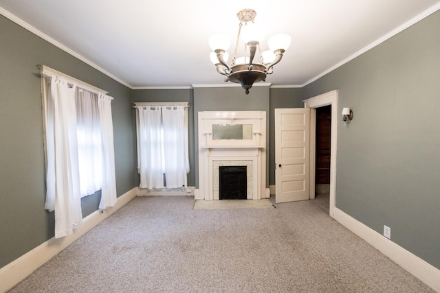 unfurnished living room featuring carpet flooring, crown molding, a chandelier, baseboards, and a fireplace with flush hearth