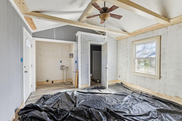 bedroom with light hardwood / wood-style floors and lofted ceiling with beams