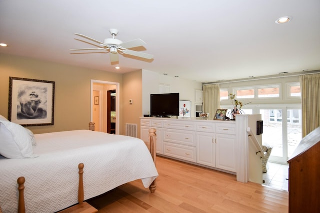 bedroom featuring ceiling fan and light hardwood / wood-style floors