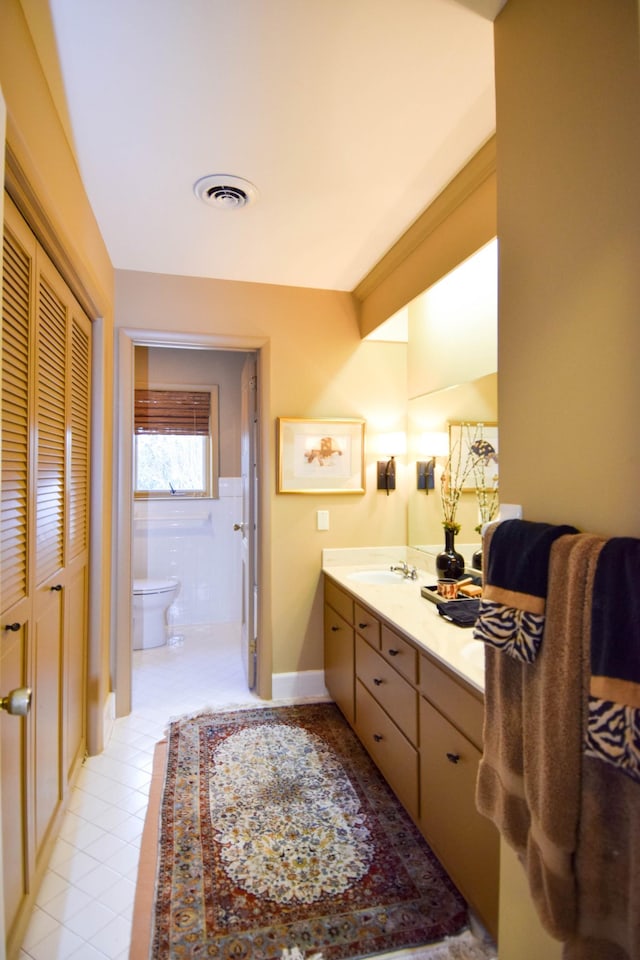 bathroom with tile patterned floors, toilet, and vanity