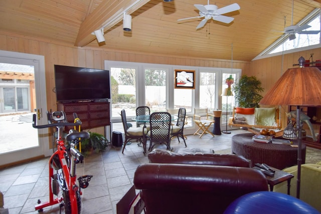 living room with ceiling fan, wooden walls, a healthy amount of sunlight, vaulted ceiling, and wooden ceiling