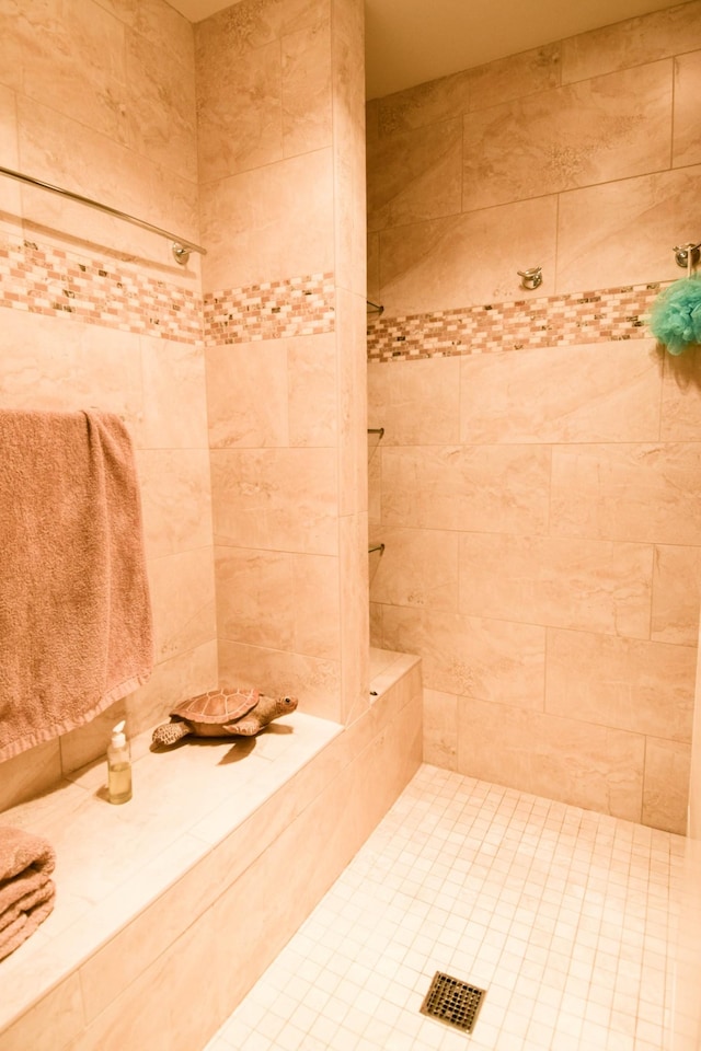 bathroom with a tile shower