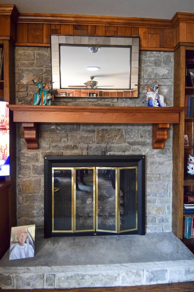 interior details featuring a stone fireplace