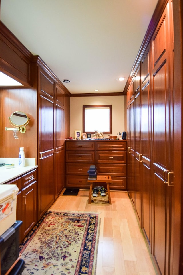 interior space with ornamental molding and hardwood / wood-style floors