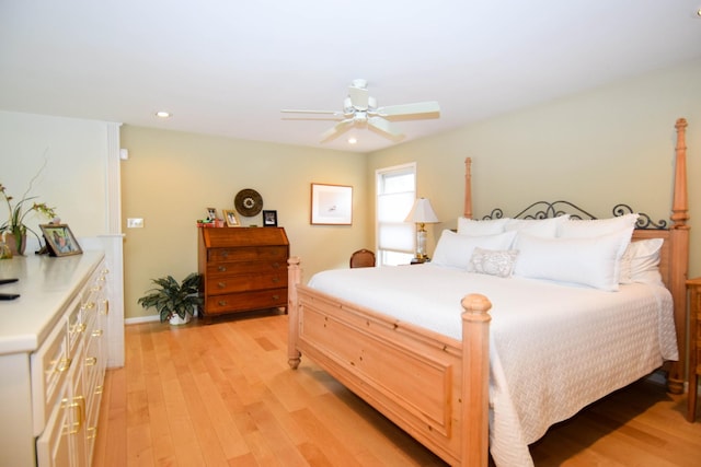 bedroom with ceiling fan and light hardwood / wood-style flooring